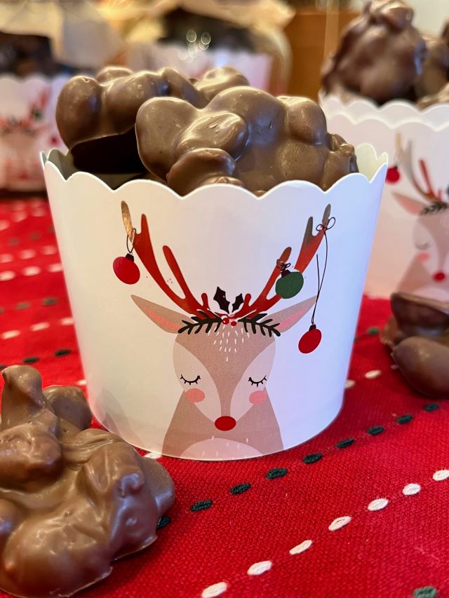 Chocolate almond clusters, Santa's reindeer poop, Christmas sweets, chocolate peanuts in a reindeer cup cake holder