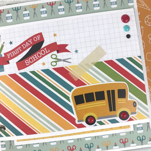 School Memories scrapbook album page with a bus, glue, scissors, and colorful stripes