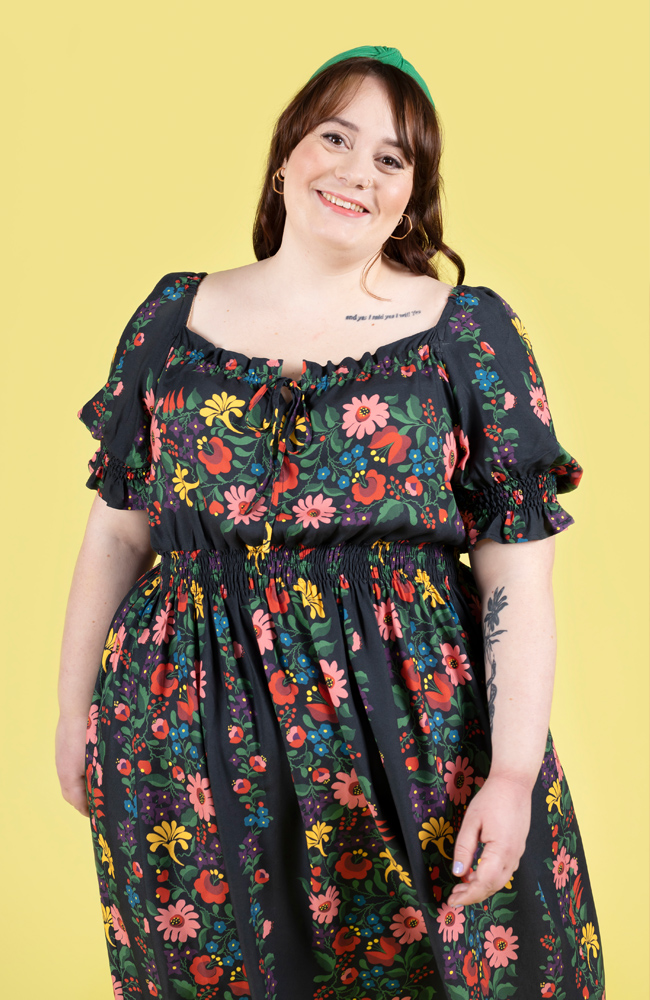 Plus size model wearing a floral shirred dress, made using Tilly and the Buttons Mabel sewing pattern