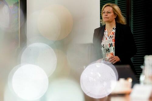 German Interior Minister Nancy Faeser walks through the cabinet room during the weekly cabinet meeting of the German government at the chancellery in Berlin, Germany, Wednesday, June 8, 2022.