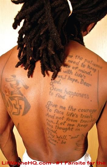 This photo is of a few of Lil' Wayne's tattoos It shows a prayer on the