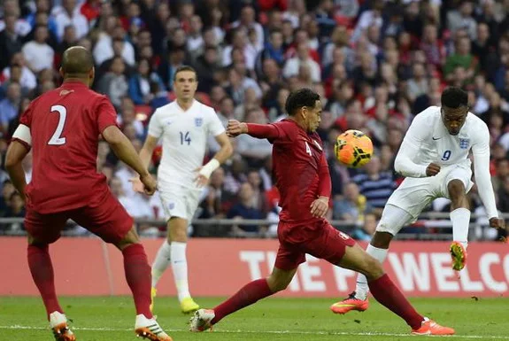 England forward Daniel Sturridge shoots to score his side's opening goal against Peru