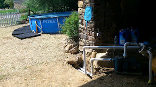 The finished job looking out from the barn past the pump towards the swimming pool - you'd never know we'd been very hard at work!