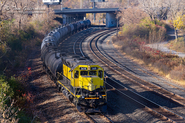 NYSW 3618 shoves a cut of tank cars west towards the I-690 overpass.