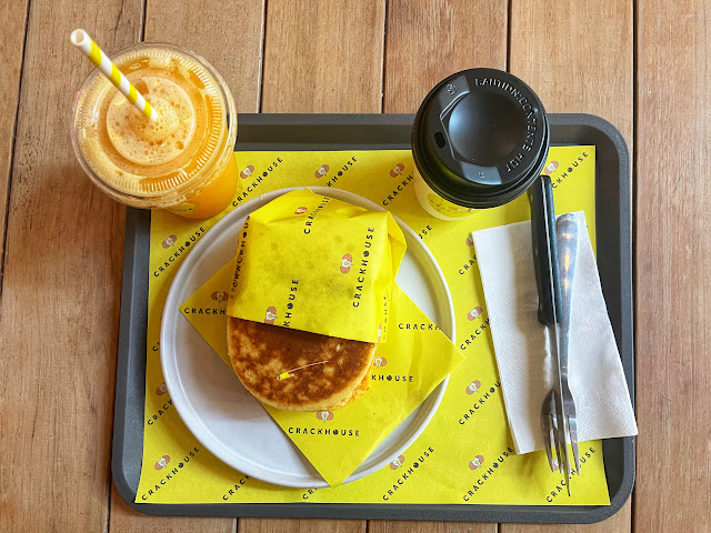breakfast sandwich, fresh orange juice, and hot coffee in Bangkok, Thailand