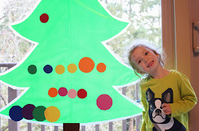 Sticky Kid-Sized Christmas Tree with reusable ornaments - you can decorate all season long!  From Fun at Home with Kids