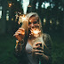 Girl play with fireworks in nature