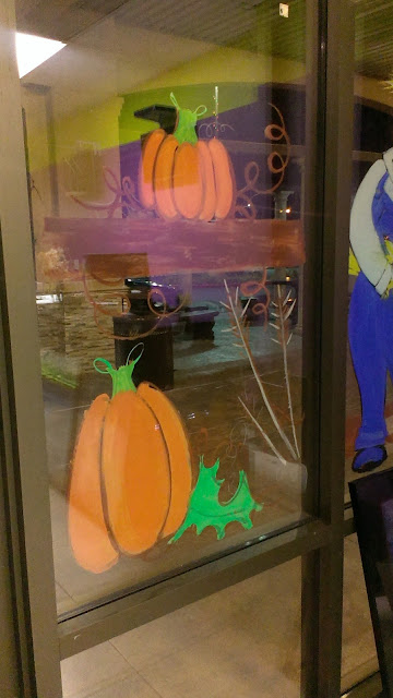 Interior view of Fall window painting - pumpkins