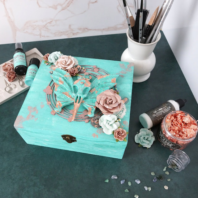 mixed media altered box: Tim Holtz Distress salvaged patina, Finnabair Resin bats and birds raven skull mould, copper flakes, Prima Marketing paper flowers, lace, trim; chipboard