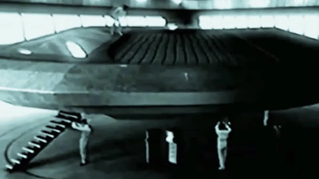 Men working on a Flying Saucer in a warehouse or top secret facility in the United States in 1959.