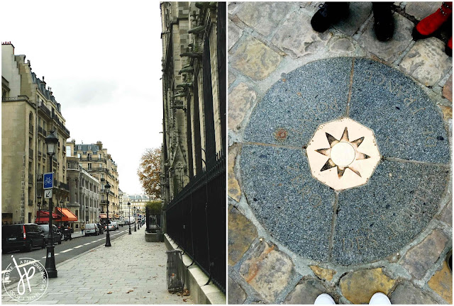 street in paris, bronze plaque on cobblestone