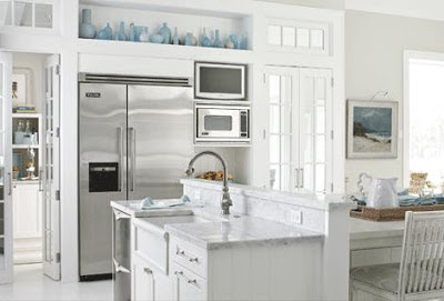 mylittlehousedesign.com blue glass collection on top of white cabinets