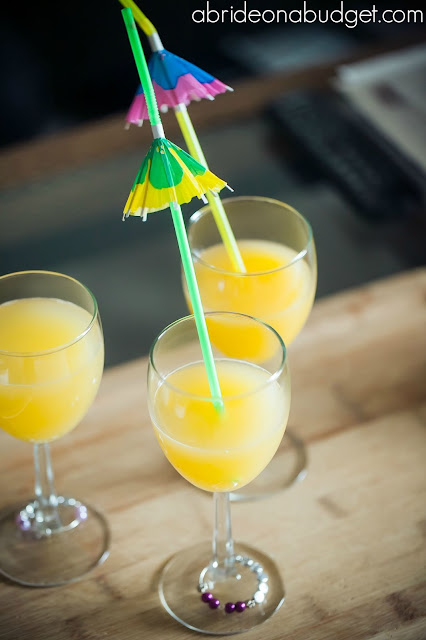 Start your wedding morning off right with a Morning Mimosa Bar. Find out how at www.abrideonabudget.com.