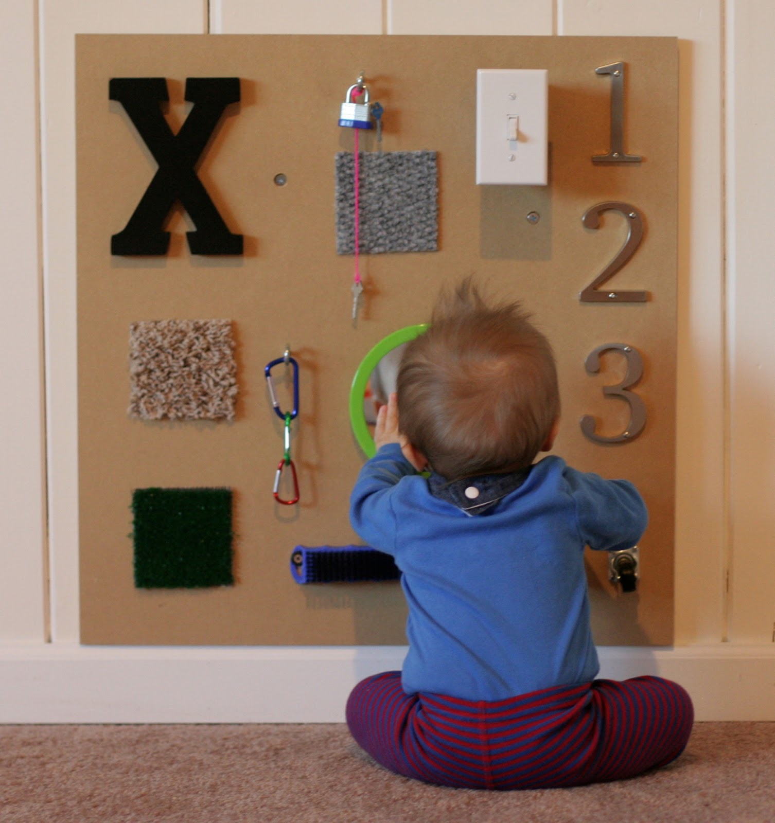 Three different DIY sensory boards along with ideas for how to include older siblings from Fun at Home with Kids