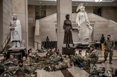 color photograph of National Guard soldiers resting in US Capitol, January 13, 2021 by David Butow