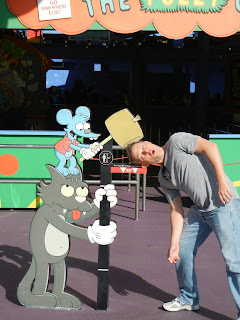 Greg making sure he is the right height for The Simpsons Ride.