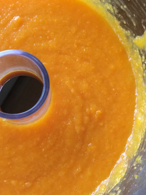 Homemade baby food in a food processor bowl.