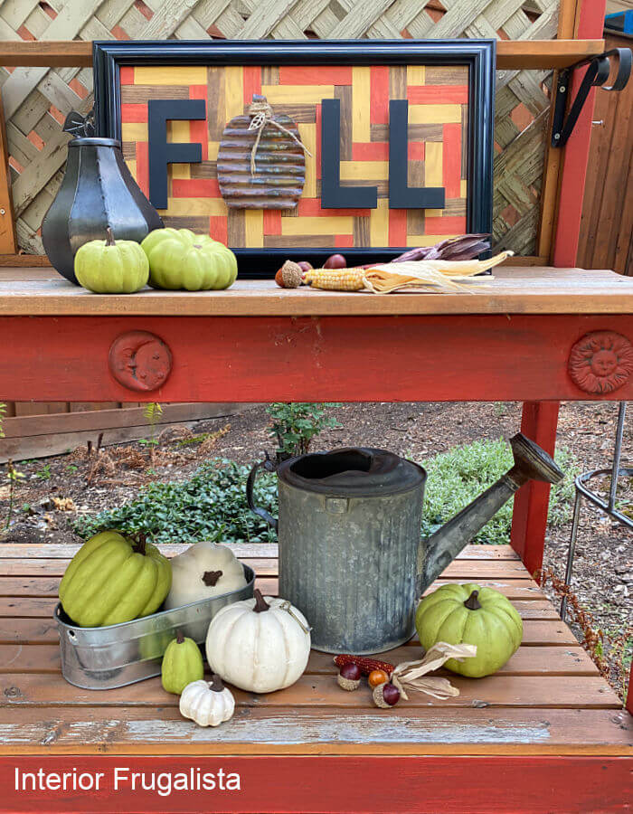 An easy beginner recycled wood tile geometric mosaic fall wall art with a simple pattern that doesn't require intricate cuts, stained in fall colors.