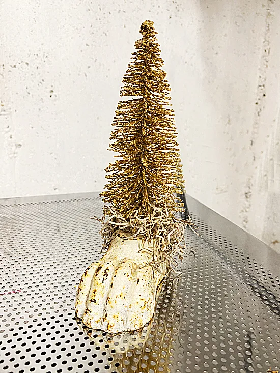 gold tree in claw foot