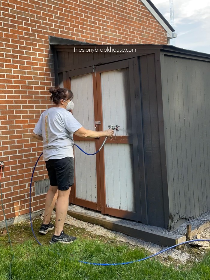 Spray painting lean to shed