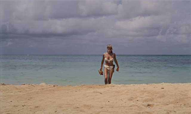 Ursulla Andress as Honey Ryder in her iconic white bikini, Honey Rider