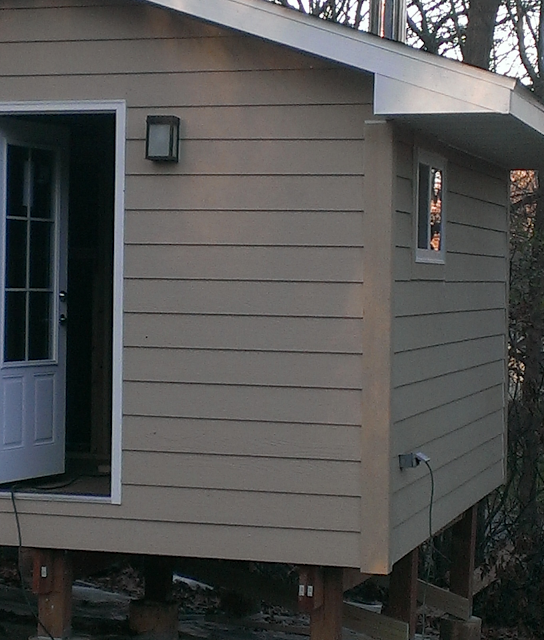 An inlet on the outside to supply power to the sauna lights and outlets.