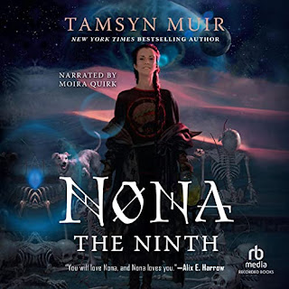 Cover for audiobook "Nona the Ninth" by Tamsin Muir. Main image is a young woman with brown hair and fair skin. She is smiling. Her right arm is half raised, her right arm lowered (matching the pose of the cover images for the covers of the previous two books in this sequence). To the woman's left is a misshapen skeleton. To her right, a dog with six legs. Around her feet, more bones. Behind her, a landscape of orange-lit dunes and a night sky containing a moon and what seems to be an enormous eye.