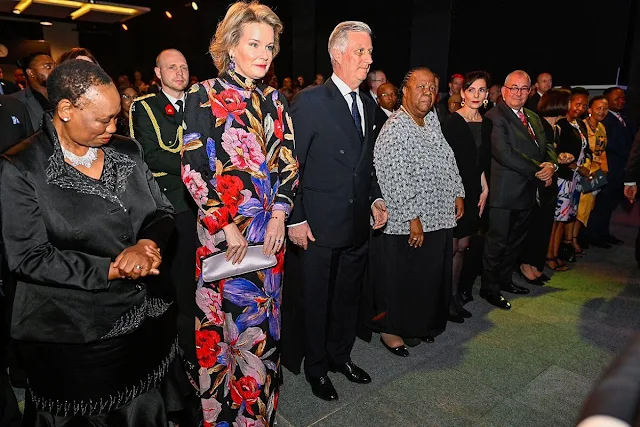 Queen Mathilde wore a new Giant Lilies print maxi dress by Dries Van Noten. Floral print dress. President Cyril Ramaphosa
