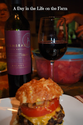 Hamburger on Pretzel Bun with wine