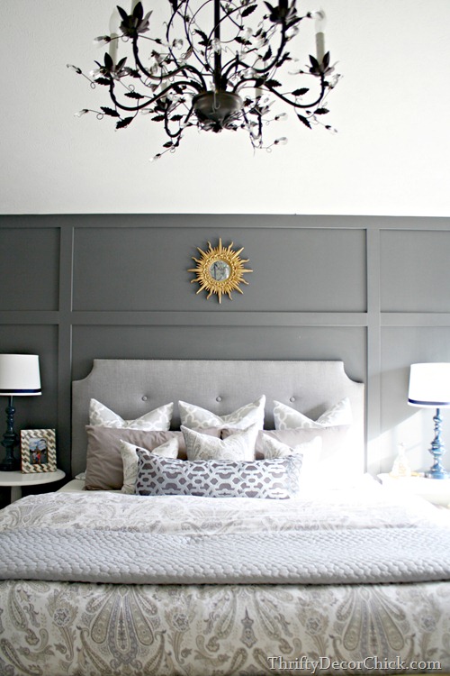 paneled wall behind bed