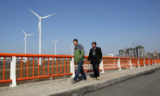 Wind turbines in Tianjin. China and the EU say they are determined to forge ahead with Paris and accelerate the global transition to clean energy. (Photograph Credit: Bloomberg/Bloomberg via Getty Images) Click to Enlarge.