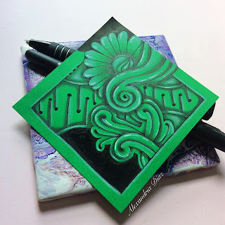 A Zentangle on green cardstock
