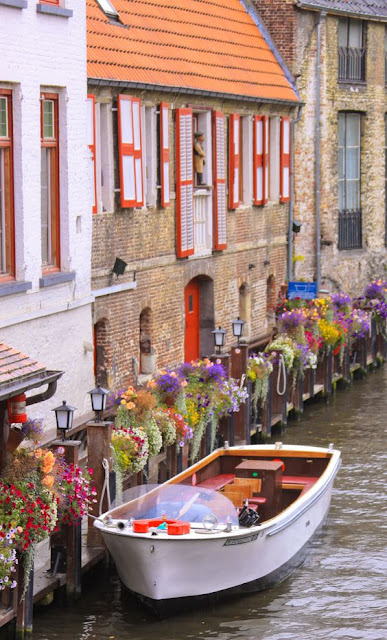 Breathtaking image of Bruges, Belgium with its medieval buildings and canal - found on Hello Lovely Studio