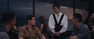 Three hotshot businessmen Soren, Dave and Bryce (Arturo Castro, Mark St. Cyr, and Rob Yang) and Elsa (Hong Chau) in The Menu