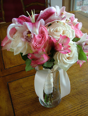 Stargazer lilies pink alstromeria pink and white roses and pink orchids 