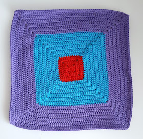 Bright colourful crochet colour-block squares.