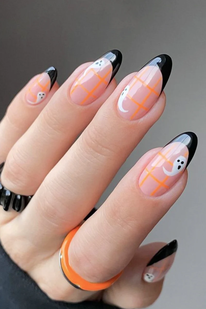 close-up of a female hand with minimal Halloween nail look