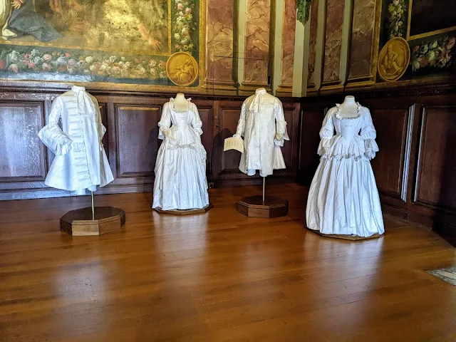 Period costumes with attached stories at Hampton Court Palace