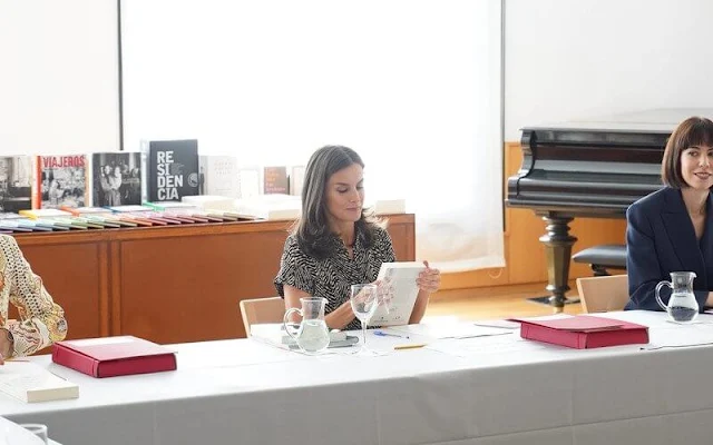 Queen Letizia wore a bow detail jumpsuit by Mango. Letizia wore her Mint and Rose Sardinia suede shoes