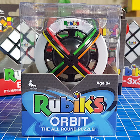 Rubik's Orbit pack shot showing round ball shaped rubik cube with coloured sections