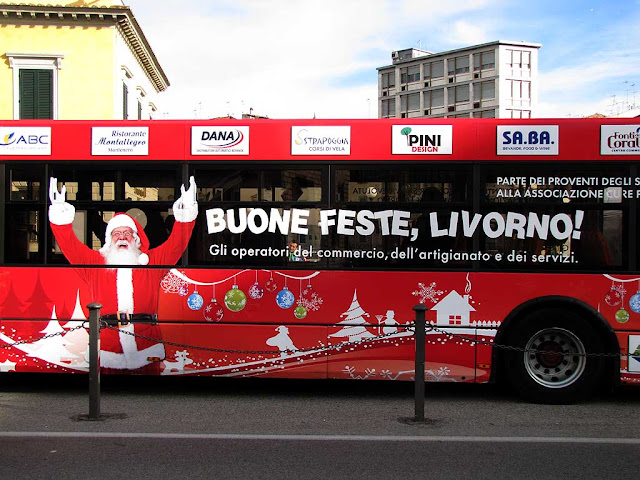 Buone feste, Livorno! on a red bus, piazza Cavour, Livorno