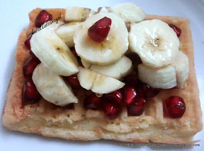 Waffle topped with Pomegranate and banana