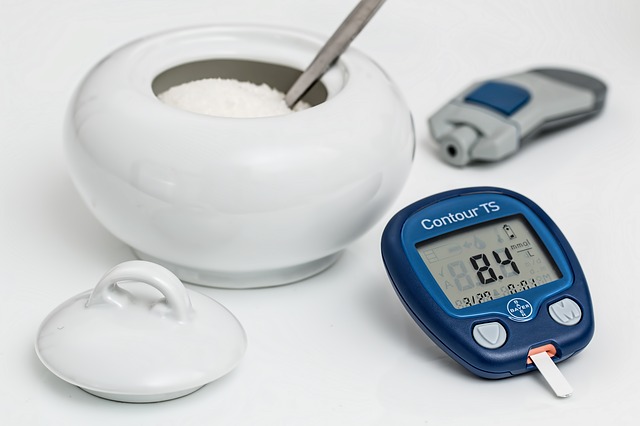 Blood Glucose Meter and Sugar Bowl Filled with Sugar