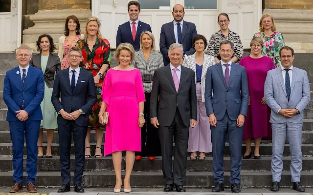 Queen Mathilde wore a new fuchsia pink silk dress by Natan. Gianvito Rossi natural leather pumps. Prime Minister Alexander De Croo
