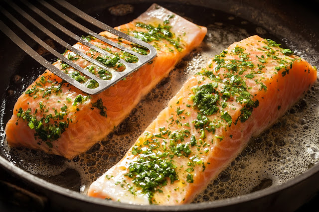 Salmon fried or cooked on the Barbecue