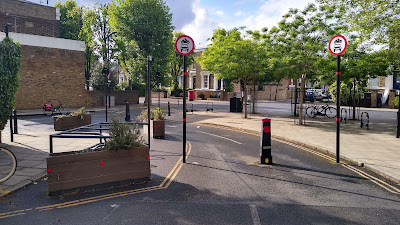 A view from the other side of the filter showing the planters and cycle parking to the left.