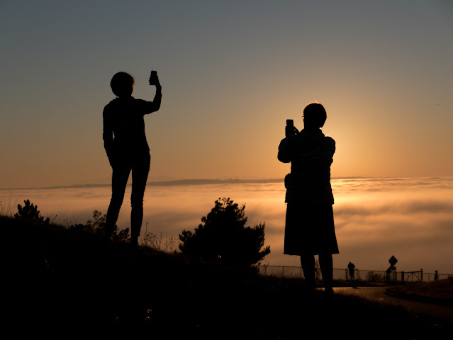Two people admire the sunset