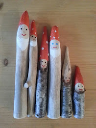 Gnomes with white beards and red hats painted on sticks.