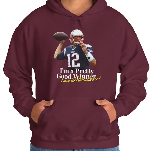 A Hoodie With NFL Player Tom Brady Holding The Duke With Right Hand and Caption I'm a Pretty Good