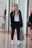 Eugenie Bouchard in Black Leggings & White T-Shirt at Melbourne Airport